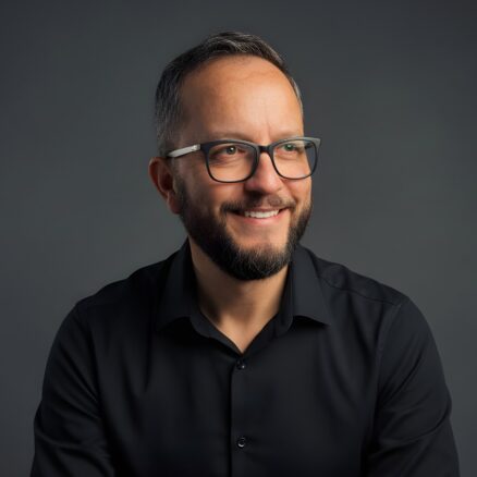 Colin Scotland - Headshots x1080 Smiling man with glasses, black shirt